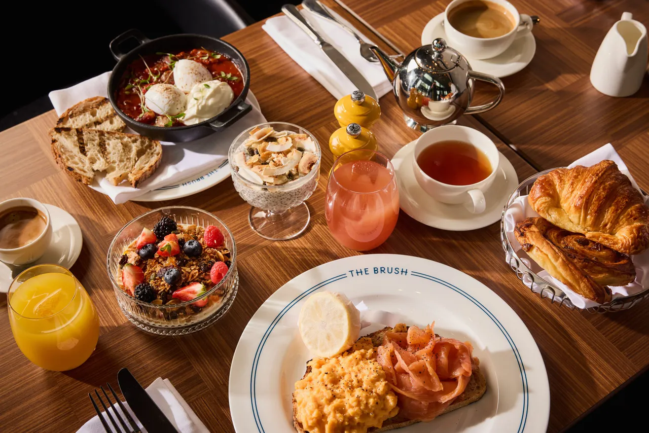 A breakfast spread with eggs, pastries and fresh juice at The Brush.