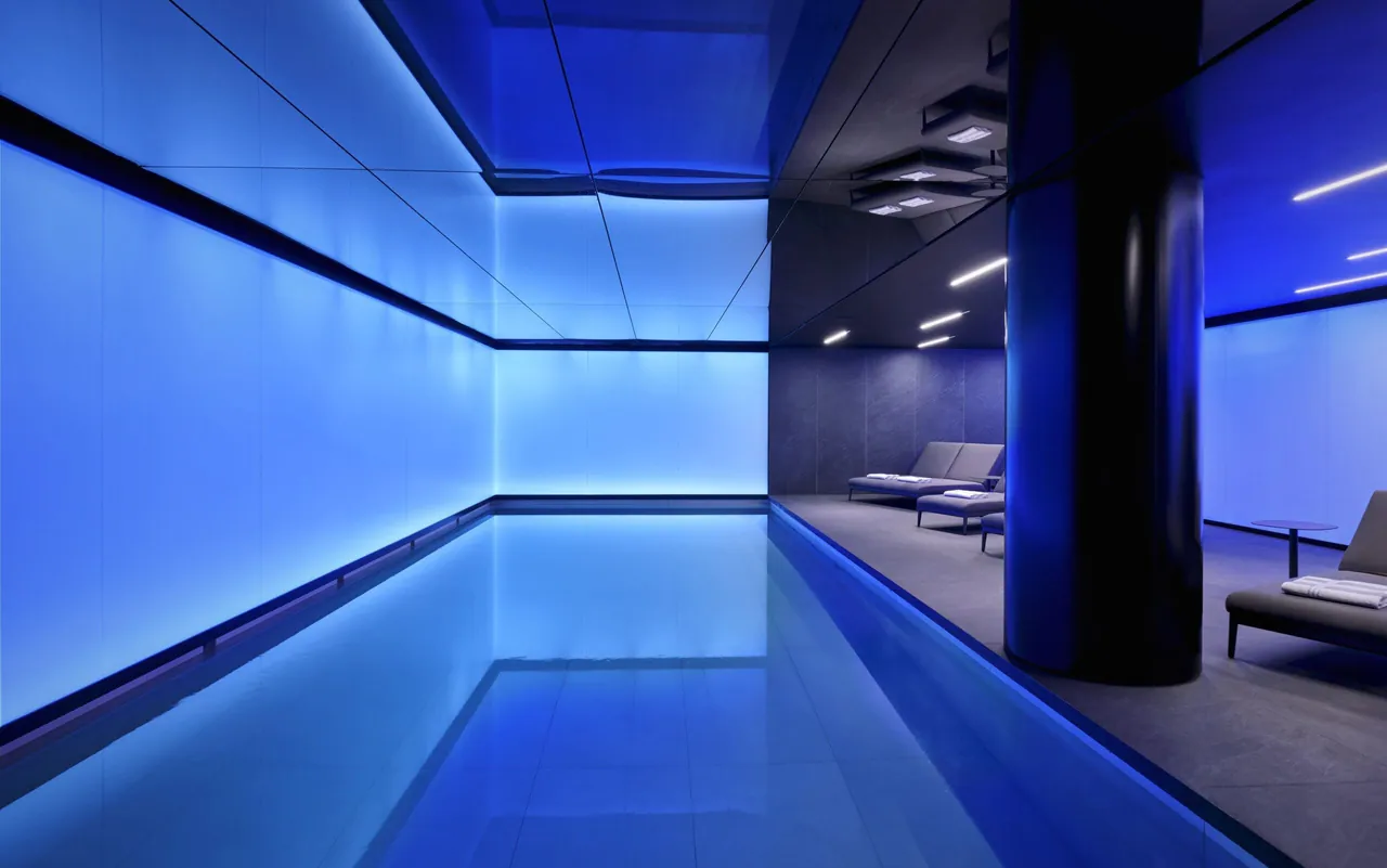 The indoor pool glowing blue in the spa.