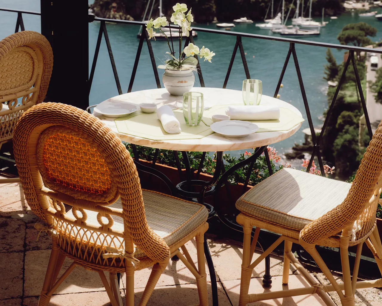 A table laid on the terrace of La Terrazza, above the boats in the bay.