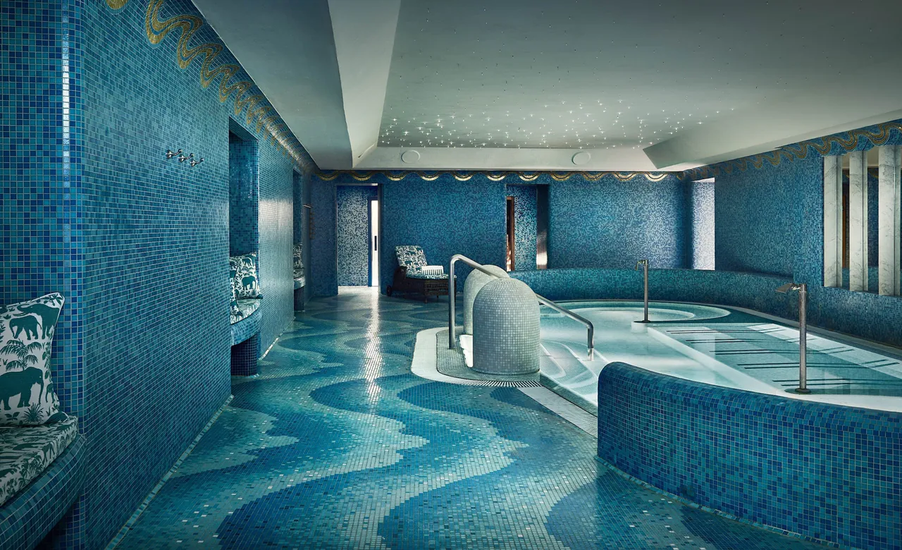 The spa pool lined with blue mosaic tiles.