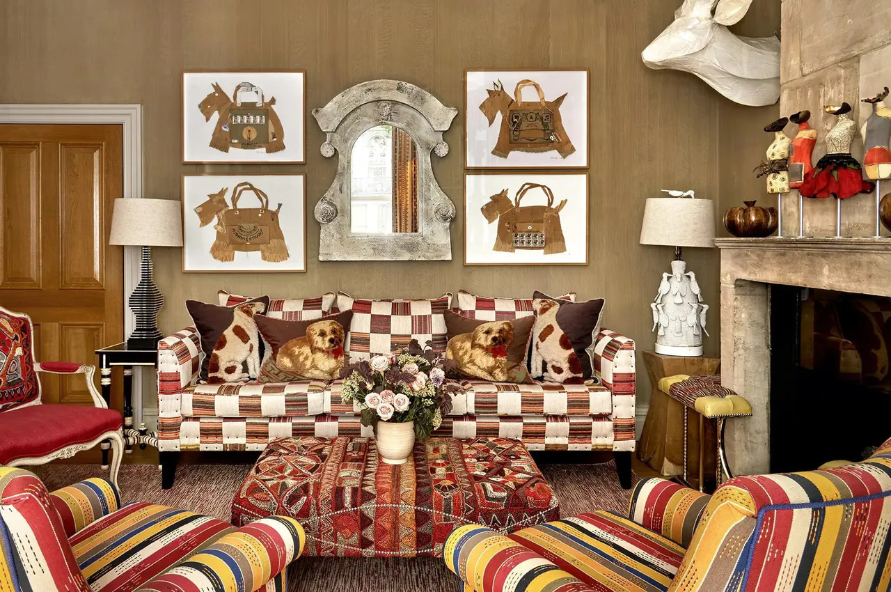 Checked sofa with patterned cushions beside the fireplace in the drawing room.