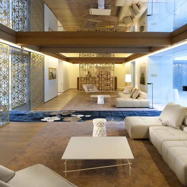 Lobby lounge at Mandarin Oriental, Barcelona, with cream sofas, gold lattice screens and a mirrored ceiling