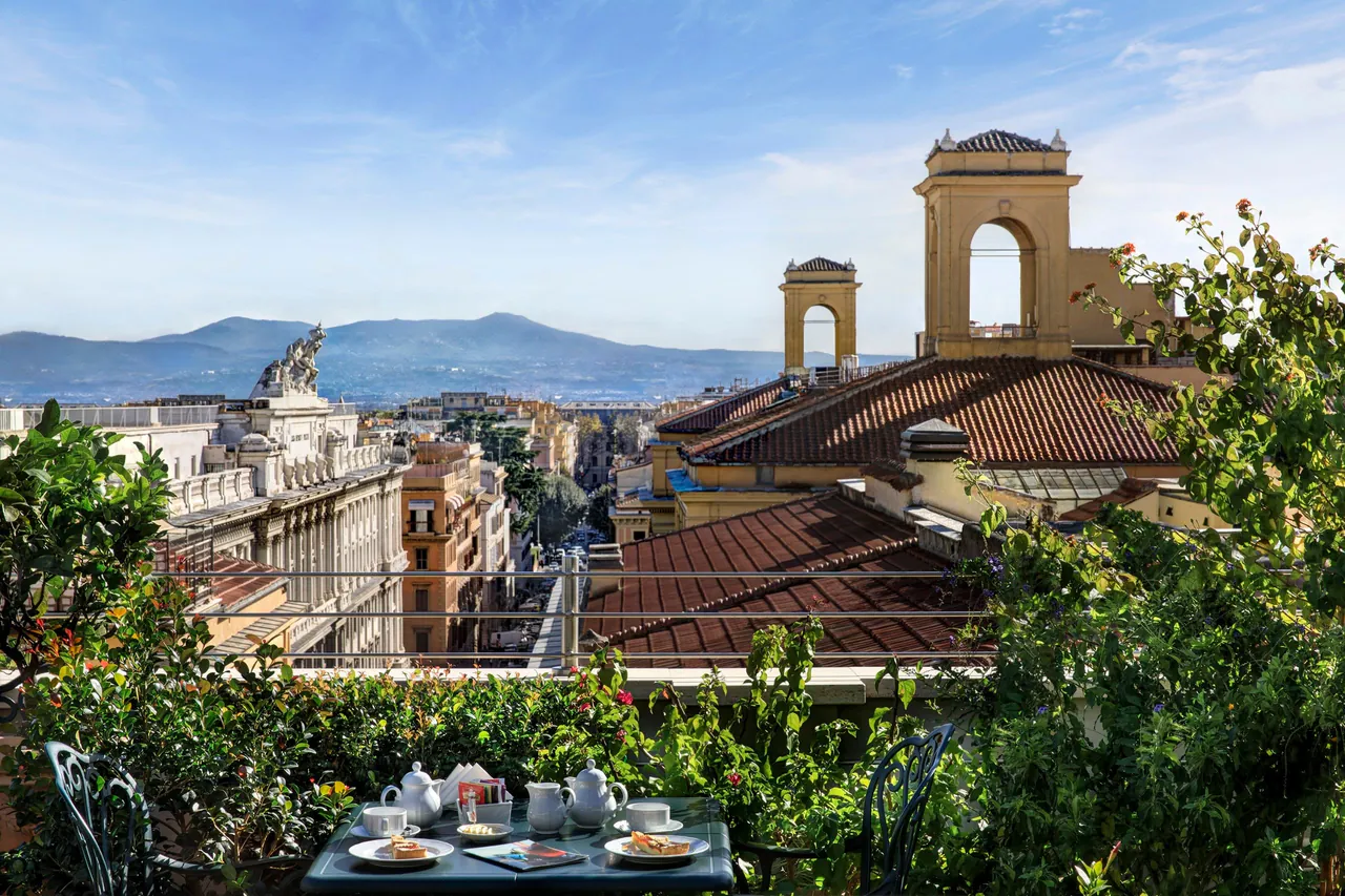The rooftop garden looking out over Roman rooftops toward the hills.